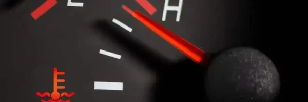 Car engine temperature sensor close up arrows